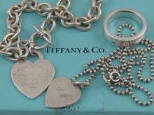 Appraisal: Tiffany Co two silver heart pendant necklaces and a silver