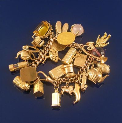 Appraisal: A gold charm bracelet the ct gold curb link bracelet