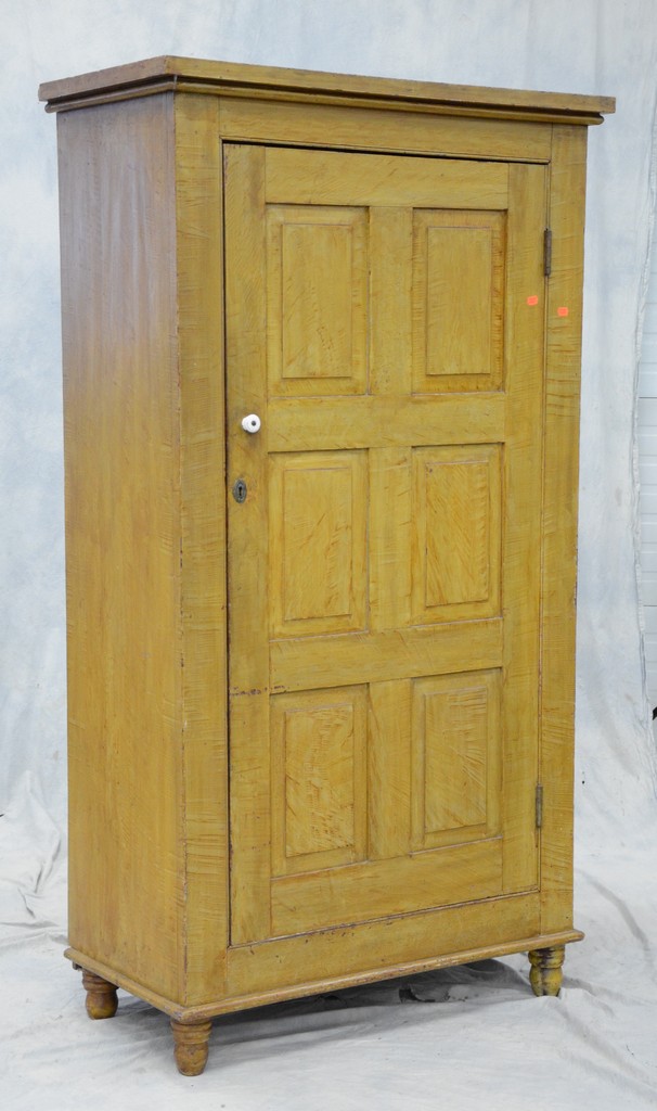 Appraisal: Grain painted pine wall cupboard single door with raised panels