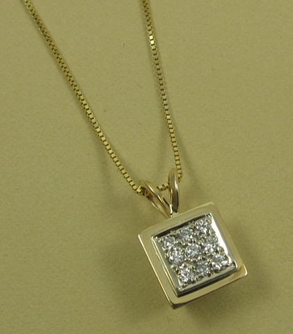 Appraisal: DIAMOND PENDANT NECKLACE The pendant is suspended on a box