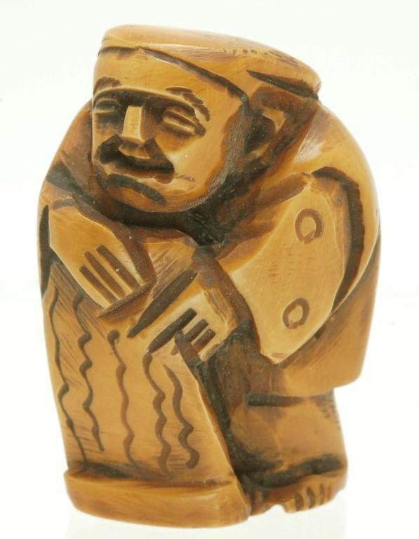 Appraisal: An ivory figural netsuke of a man Signed under base