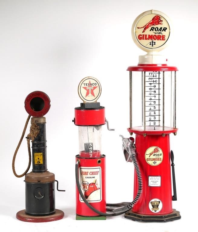 Appraisal: THREE VINTAGE TOY GAS PUMPSThree toy gas pumps including pressed