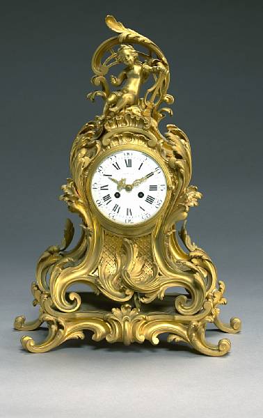 Appraisal: A Louis XV style gilt bronze mantel clock retailed by