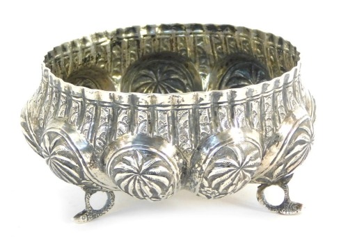 Appraisal: An Indian white metal sugar bowl fluted and repousse decorated