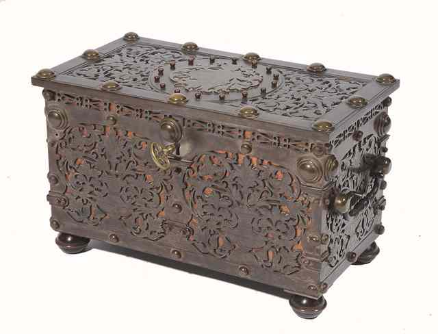 Appraisal: A CONTINENTAL STEEL AND BRASS MOUNTED CASKET with pierced foliate