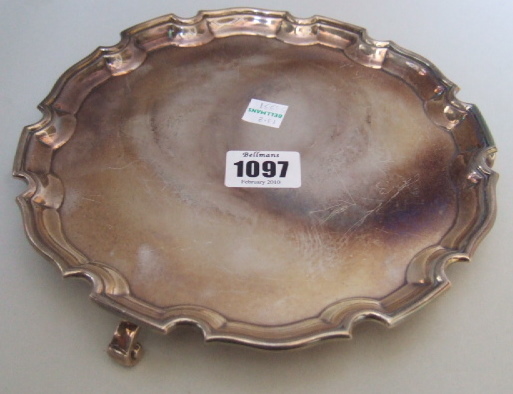 Appraisal: A Britannia Standard silver shaped circular salver decorated with a