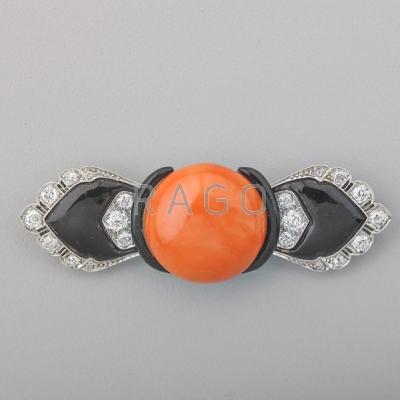 Appraisal: ART DECO CORAL DIAMOND AND ENAMEL PLATINUM BROOCH Button-shaped orange