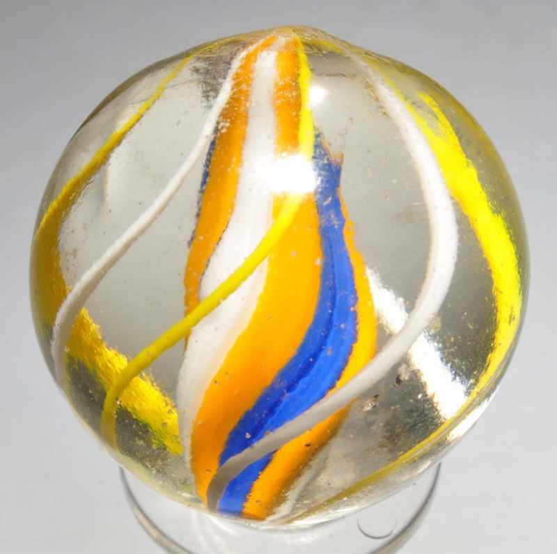 Appraisal: Large English Solid Core Swirl Marble Description Bright yellow blue