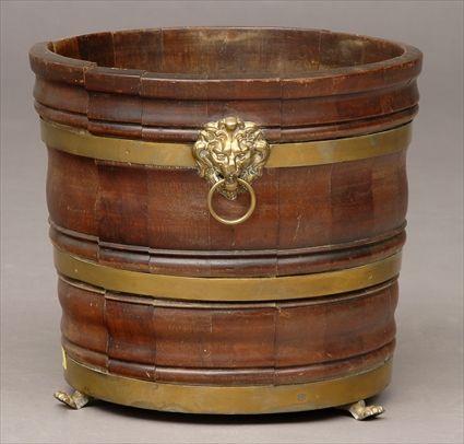 Appraisal: REGENCY BRASS-BANDED MAHOGANY BUCKET The cylindrical bowl with bomb bands