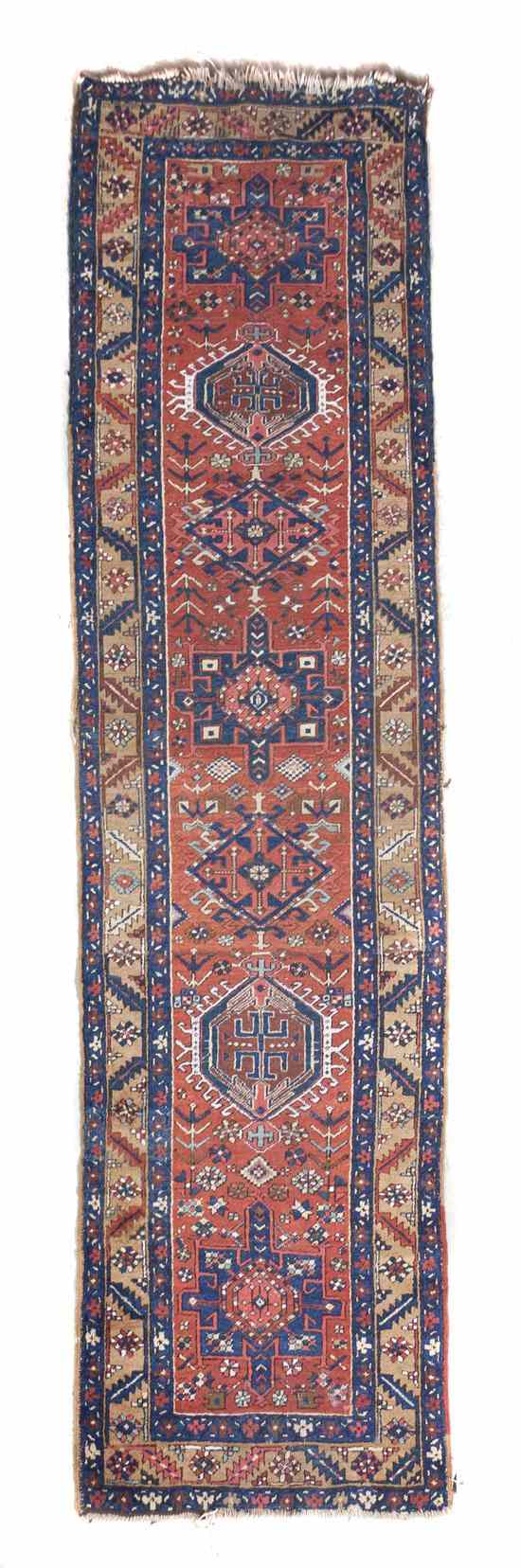 Appraisal: A Northwest Persian Wool Runner having seven geometric medallions on