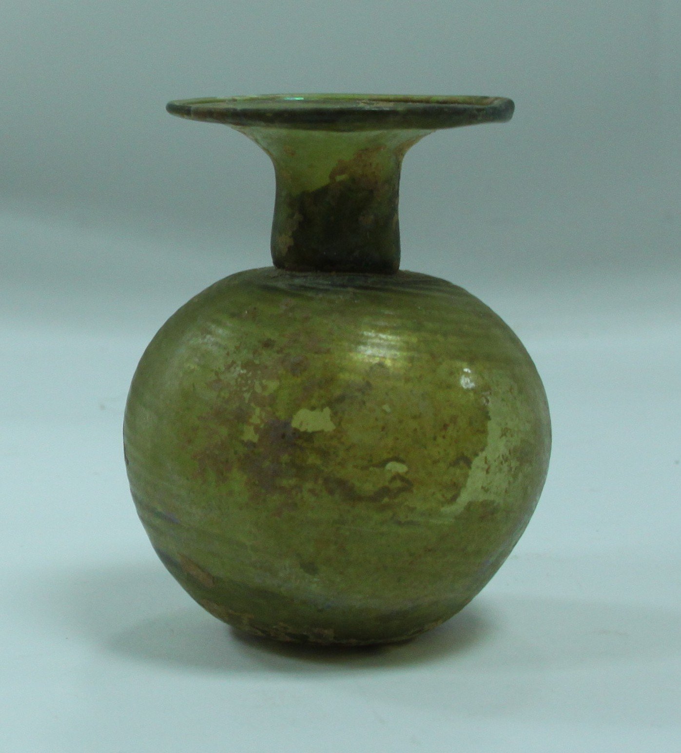 Appraisal: An ancient Roman glass globular vase with narrow neck and