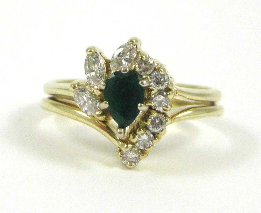 Appraisal: EMERALD DIAMOND AND FOURTEEN KARAT GOLD RING with three marquise-cut