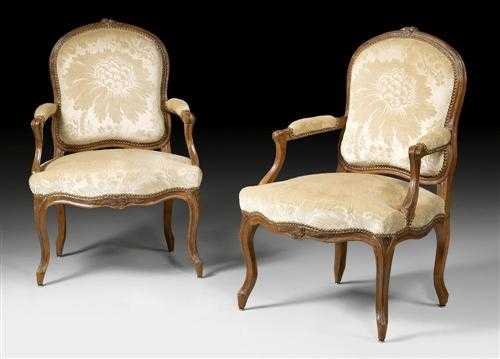 Appraisal: PAIR OF SHAPED AND CARVED BEECHWOOD FAUTEUILS A LA REINE