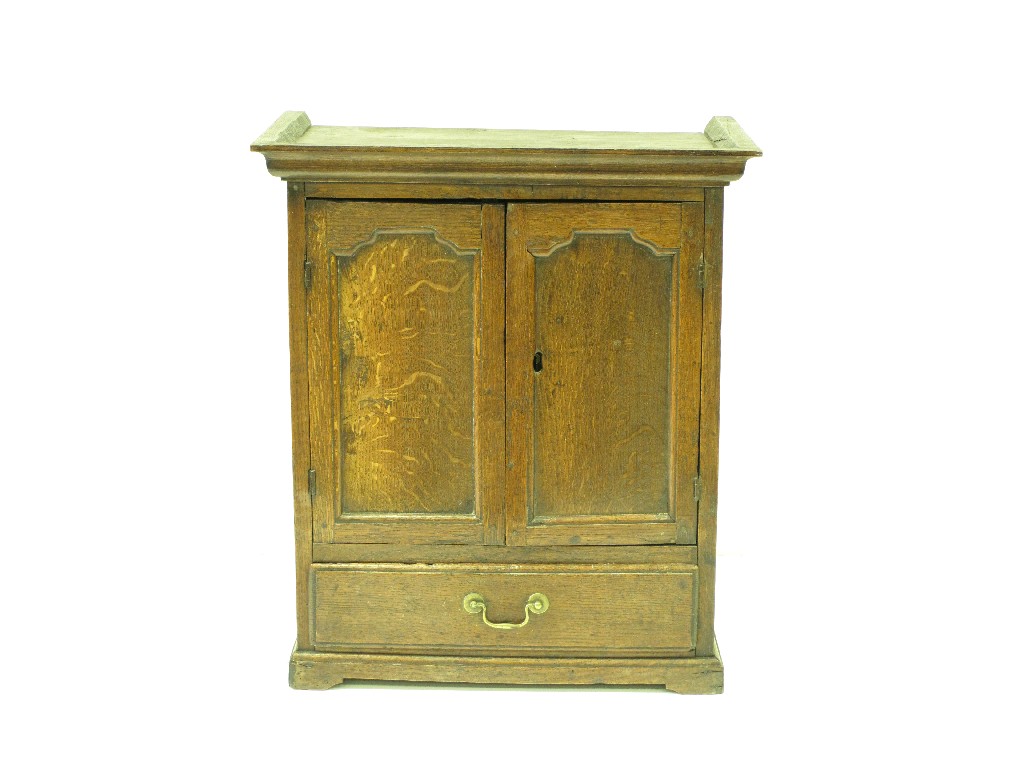 Appraisal: An antique oak Spice Cupboard with pair of shaped panelled