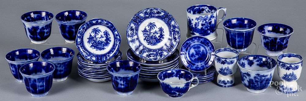 Appraisal: Flow blue cups saucer toddy plates etc Flow blue cups