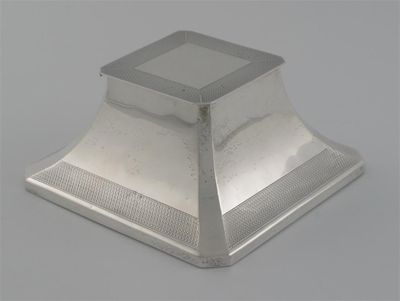 Appraisal: A modern capstan inkwell with canted corners engine turned bands