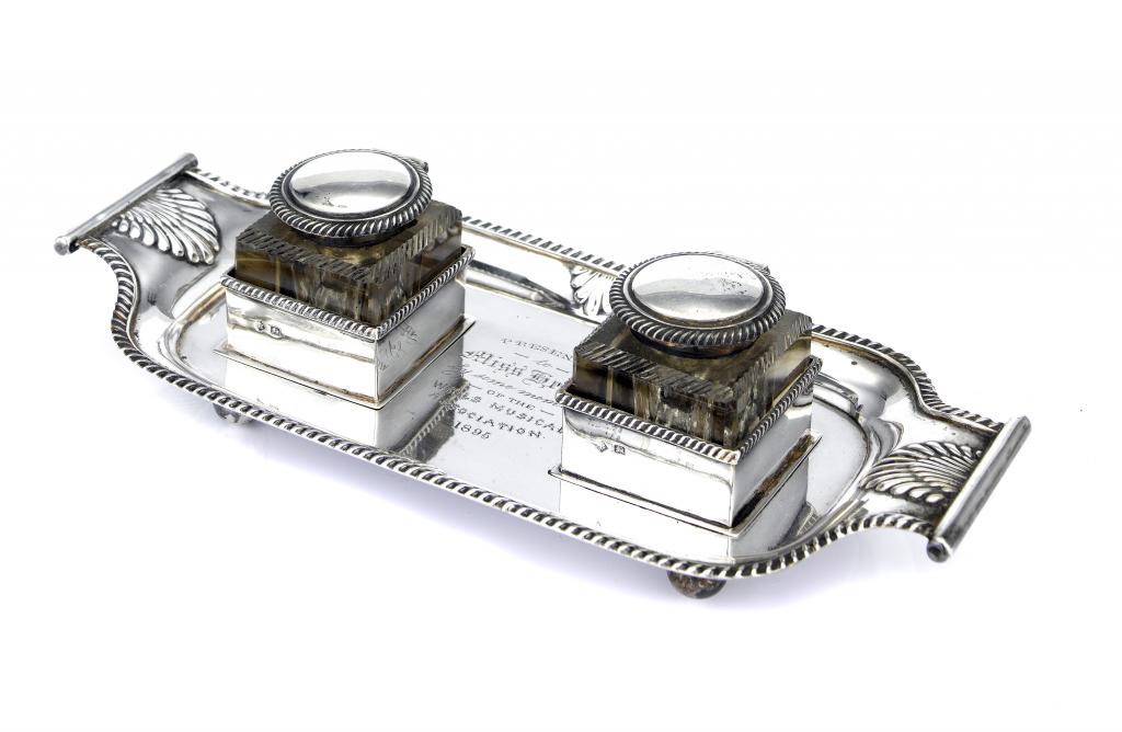 Appraisal: A VICTORIAN INKSTAND the gadrooned tray with scroll handles and