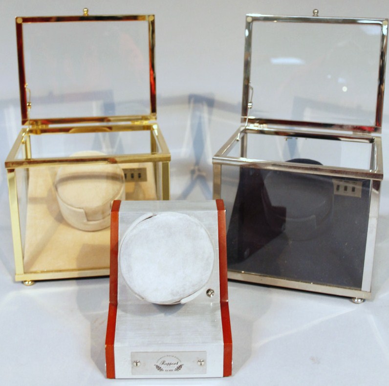 Appraisal: Three various watch display cabinets comprising a Rapport with battery