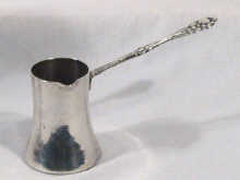 Appraisal: An Egyptian standard hallmarked silver coffee jug with cast handle