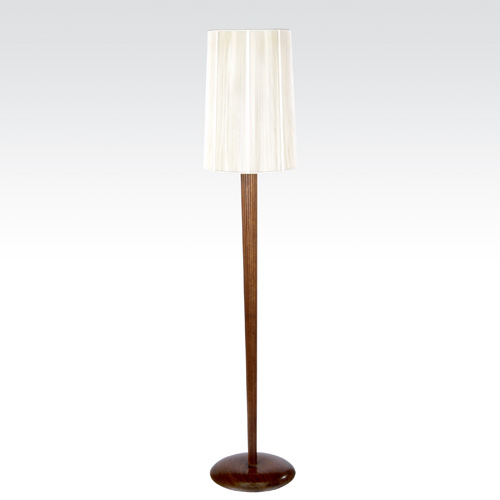 Appraisal: VLADIMIR KAGAN Walnut floor lamp with single socket glass insert