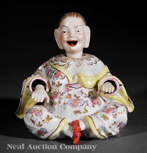 Appraisal: A Continental Polychrome and Gilt Porcelain Nodder Magot Figure c