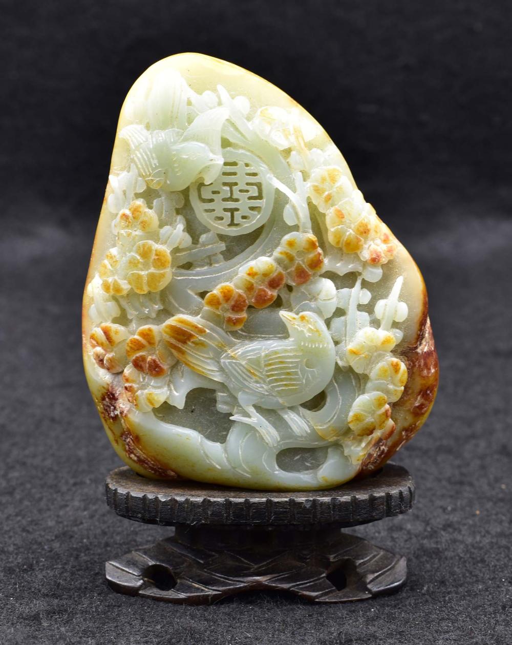 Appraisal: CHINESE CELADON AND RUSSET JADE MOUNTAINAsymmetrical depicting two birds perched