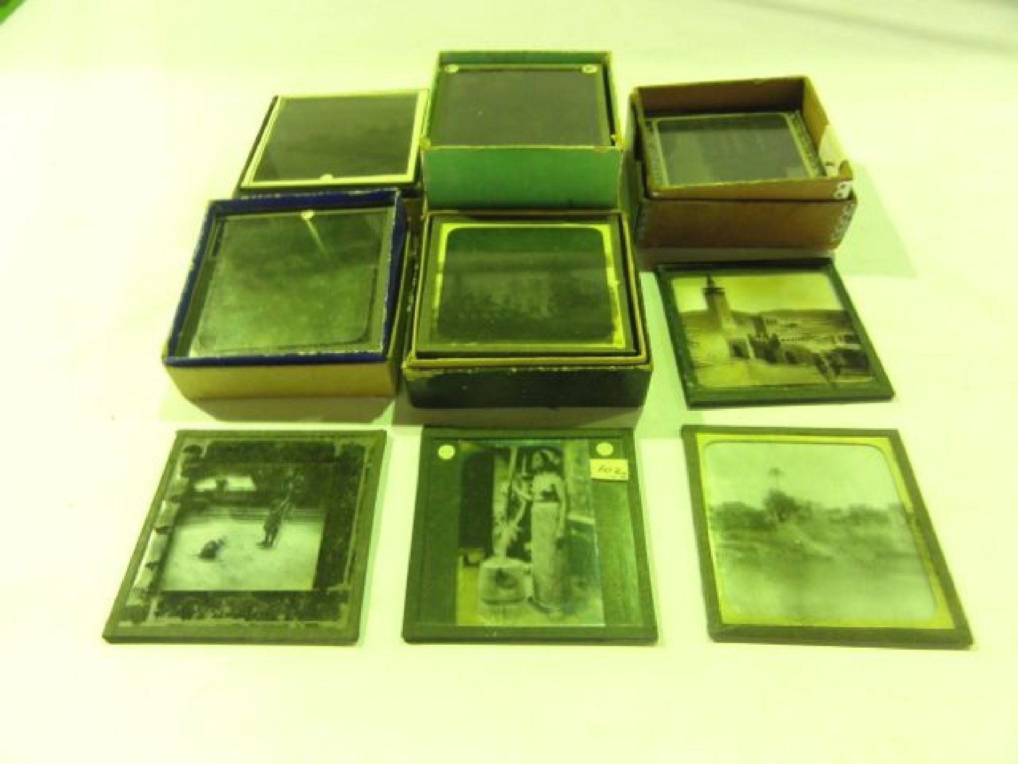 Appraisal: Five small boxes of early photographic square glass plates depicting