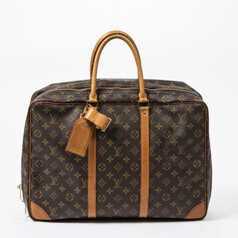 Appraisal: Louis Vuitton Sirius suitcase in brown monogram coated canvas with