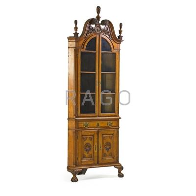 Appraisal: CHIPPENDALE STYLE CORNER CABINET Mixed woods with glass doors over