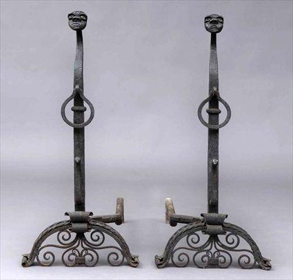 Appraisal: PAIR OF RENAISSANCE-STYLE WROUGHT IRON FIRE DOGS Each angular stem