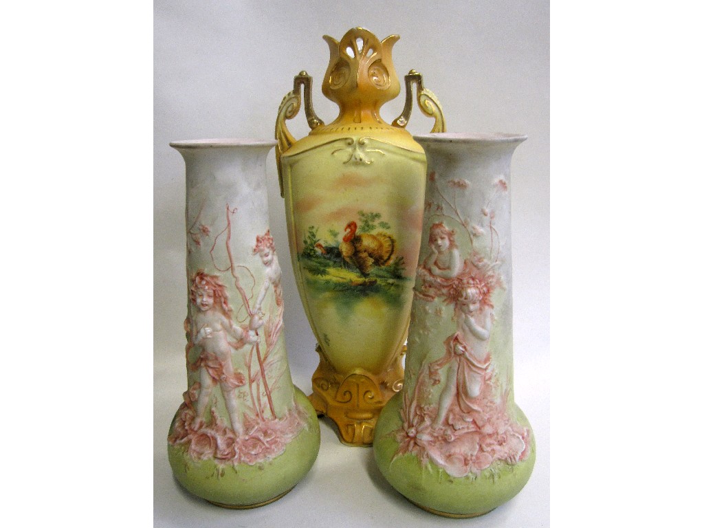 Appraisal: Pair of continental bisque vases depicting cherubs and a Royal