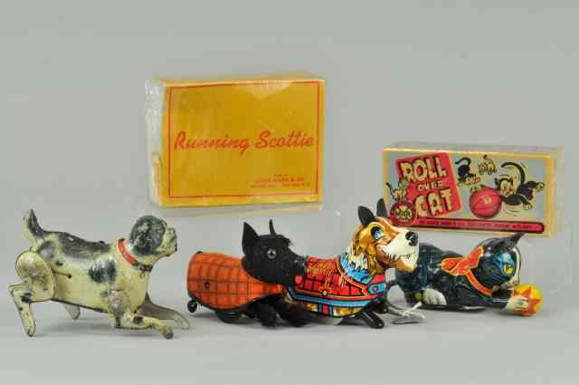 Appraisal: GROUPING OF DOG AND CAT TOYS Lot includes lithographed tin