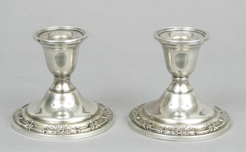 Appraisal: A Pair of Sterling Silver Candleholders A pair of weighted