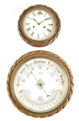 Appraisal: A large aneroid barometer with a ceramic dial signed Curtis