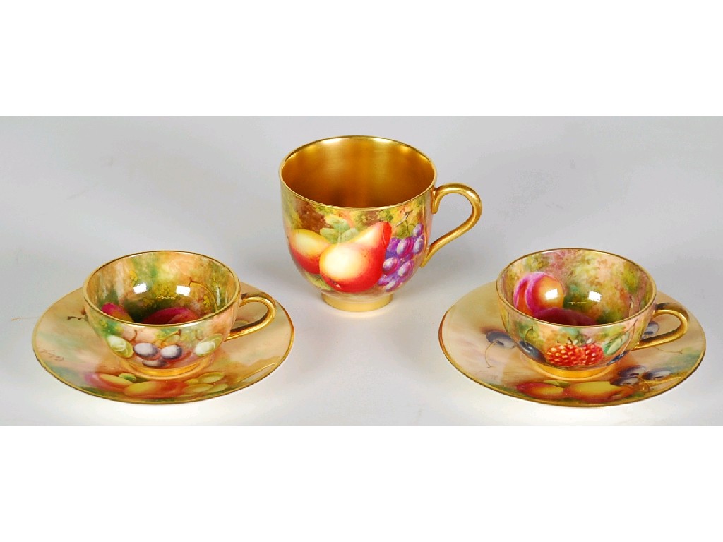 Appraisal: PAIR OF HAND PAINTED ROYAL WORCESTER MINIATURE CHINA CABINET CUPS