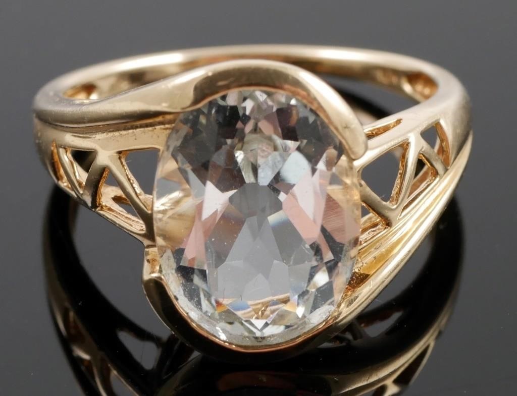 Appraisal: K yellow gold fashion ring contains one oval faceted aquamarine