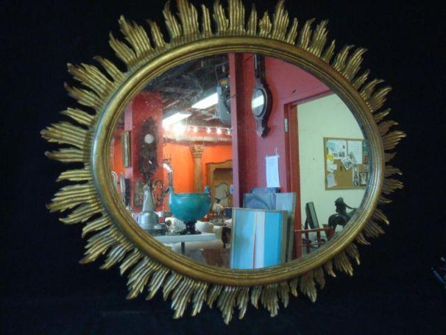 Appraisal: Giltwood Carved Sunburst Mirror Nice quality oval mirror From a