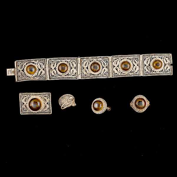 Appraisal: German Silver and Glass Cats Eye Beads A grouping of