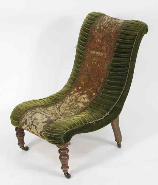 Appraisal: A beech framed nursing chair on turned front legs