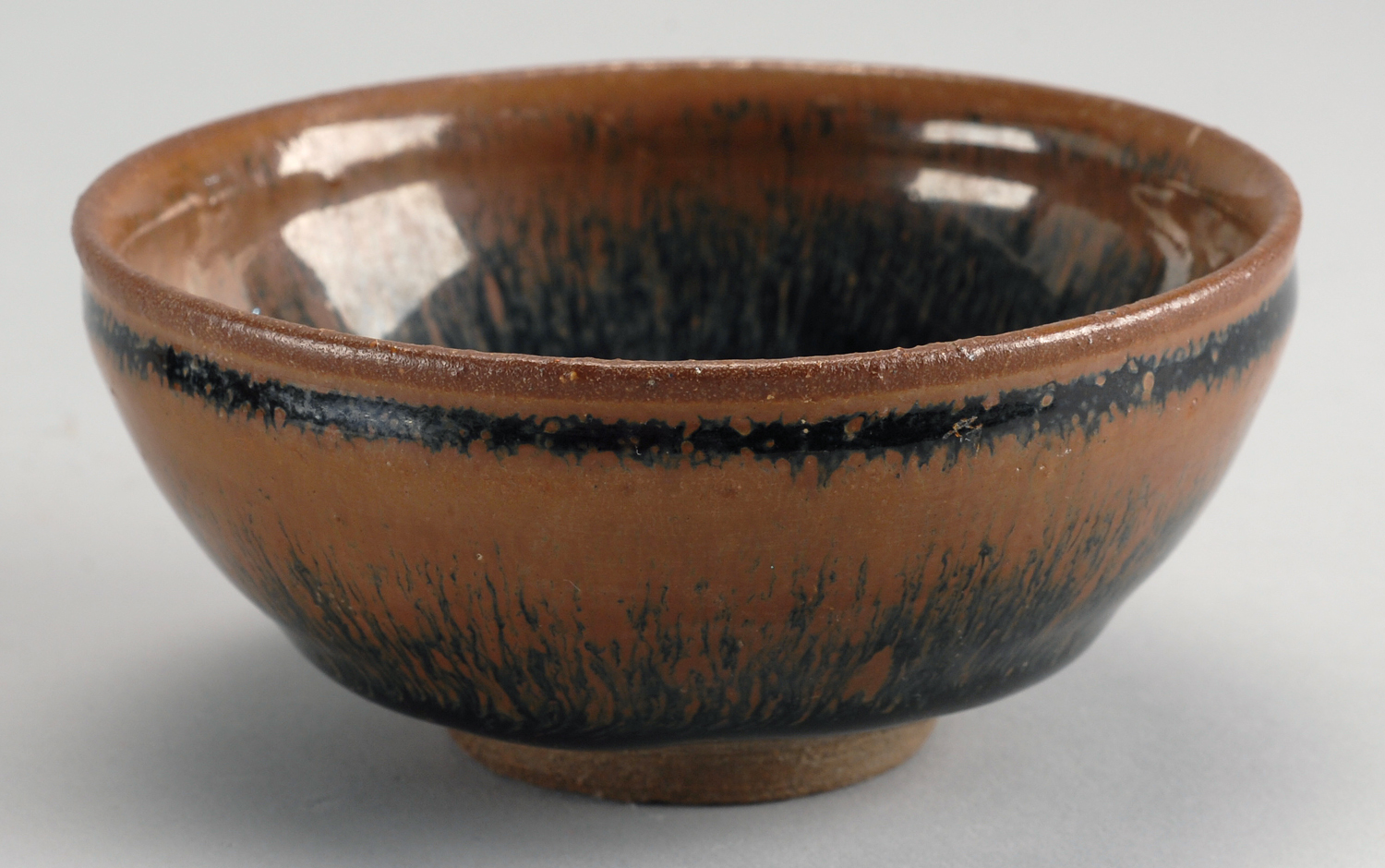 Appraisal: TEMMOKU GLAZE TEA BOWL With black and brown hare's-fur glaze