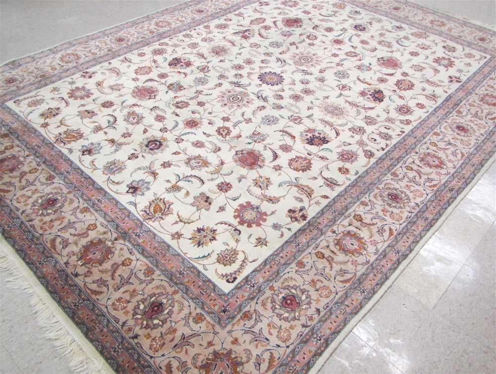 Appraisal: HAND KNOTTED ORIENTAL CARPET Pakistani-Persian Isfahan floral design on cream