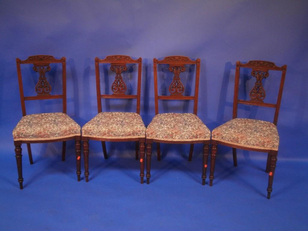 Appraisal: A set of four Edwardian stained mahogany salon chairs the