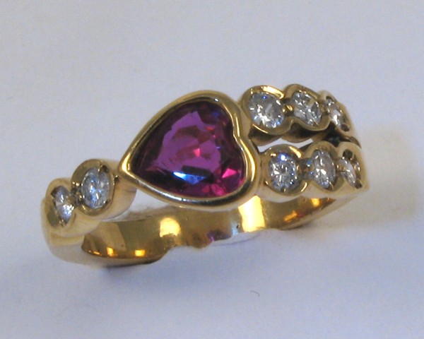 Appraisal: RUBY DIAMOND AND FOURTEEN KARAT GOLD RING set with a