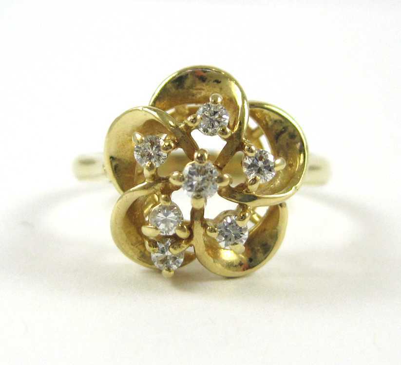 Appraisal: DIAMOND AND FOURTEEN KARAT GOLD RING The yellow gold ring