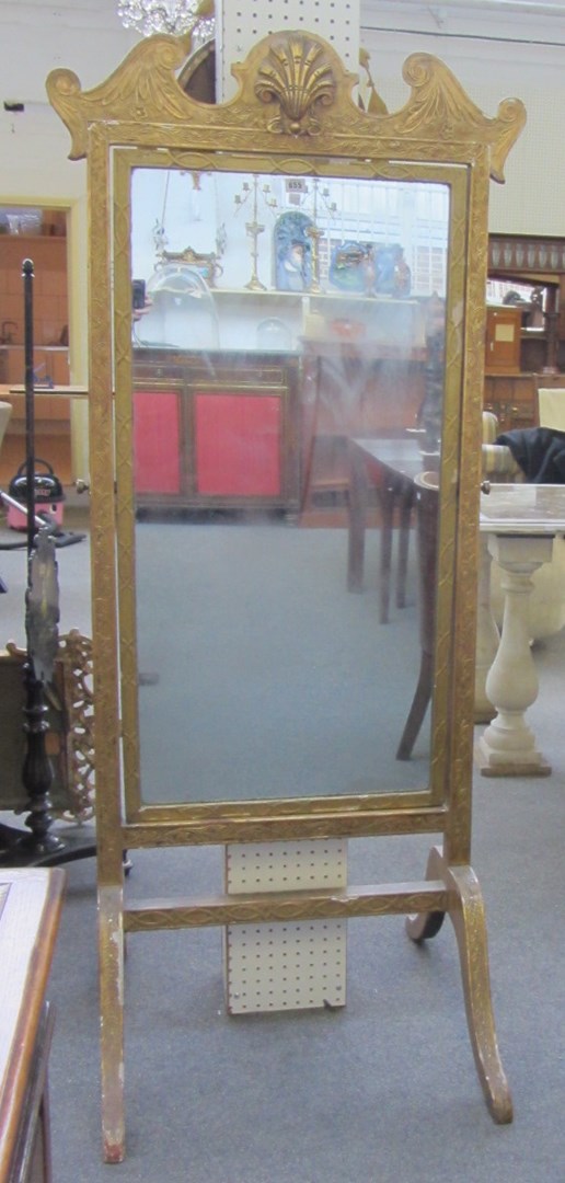 Appraisal: A th century gilt framed cheval mirror with shell mounted