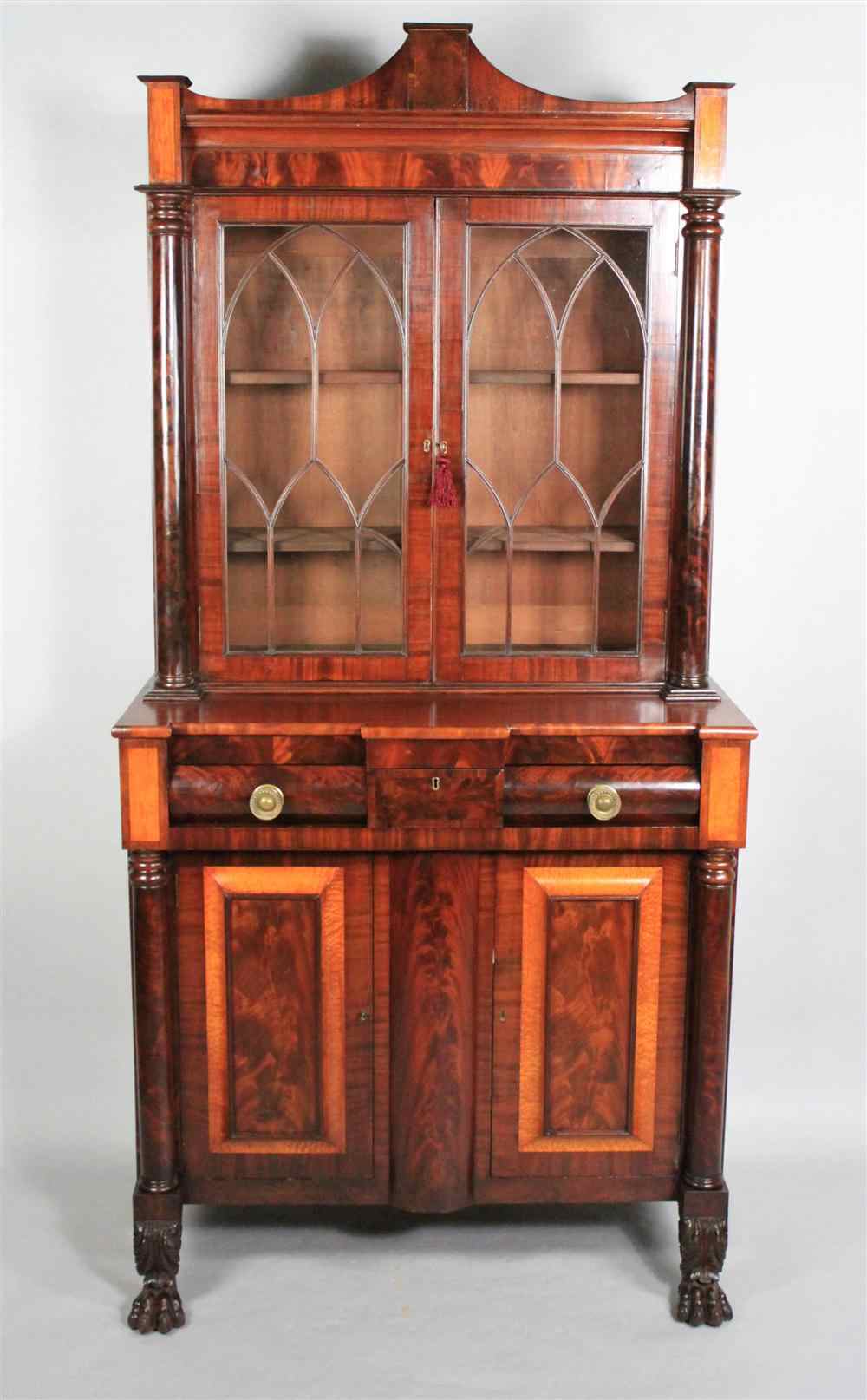 Appraisal: AMERICAN CLASSICAL MAHOGANY AND MAPLE BOOKCASE CABINET circa in two