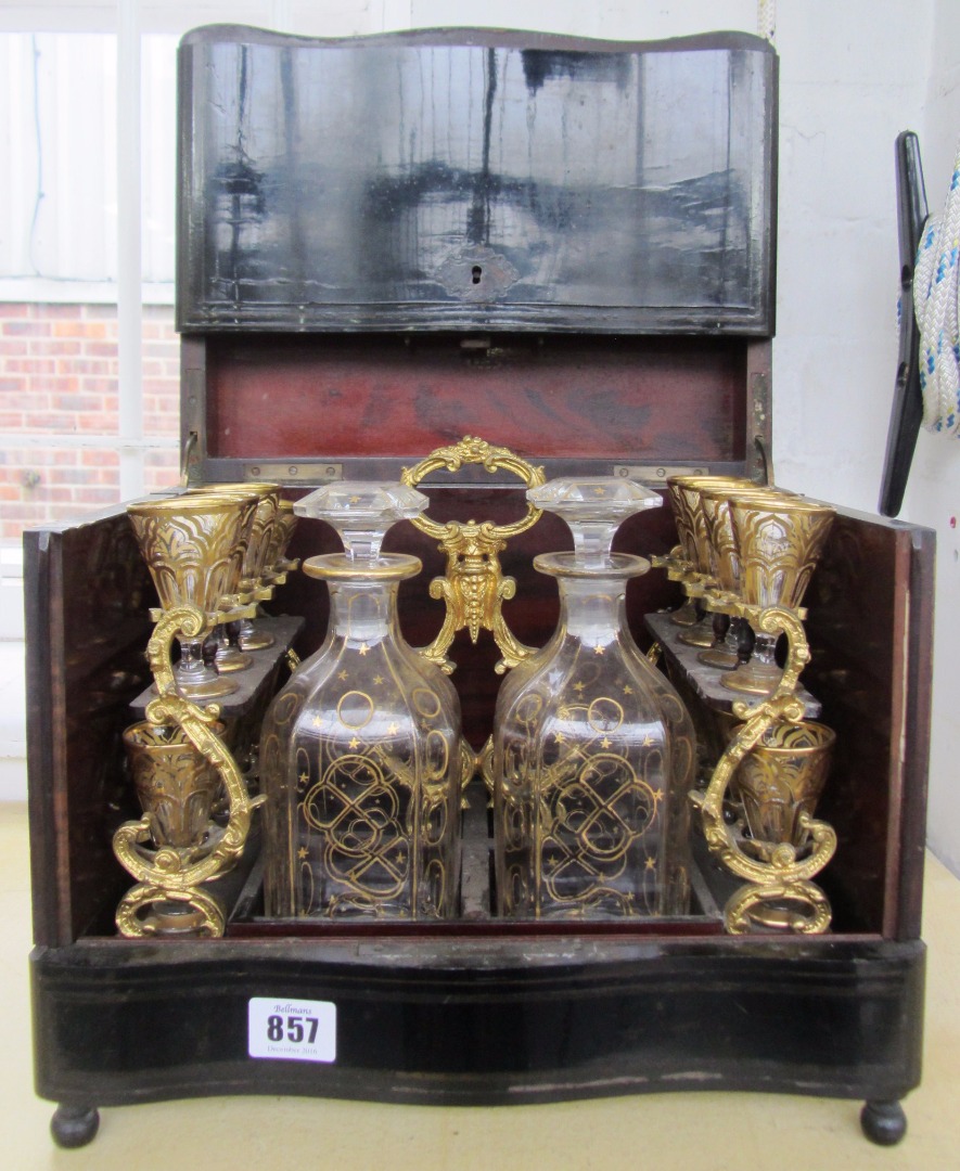 Appraisal: A rosewood and inlaid ebonised table top liquor case th