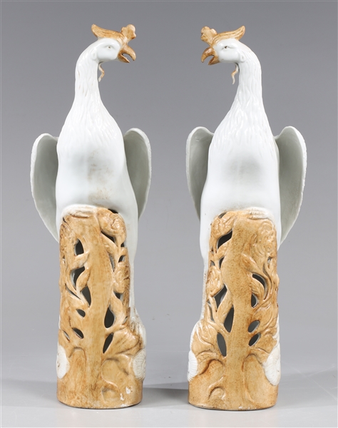 Appraisal: Pair of Chinese ceramic blanc de chine opposing phoenixes perched