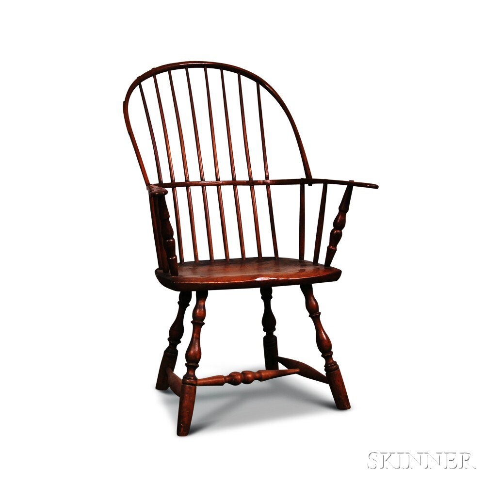 Appraisal: Sack-back Windsor Chair America late th century with shaped handholds