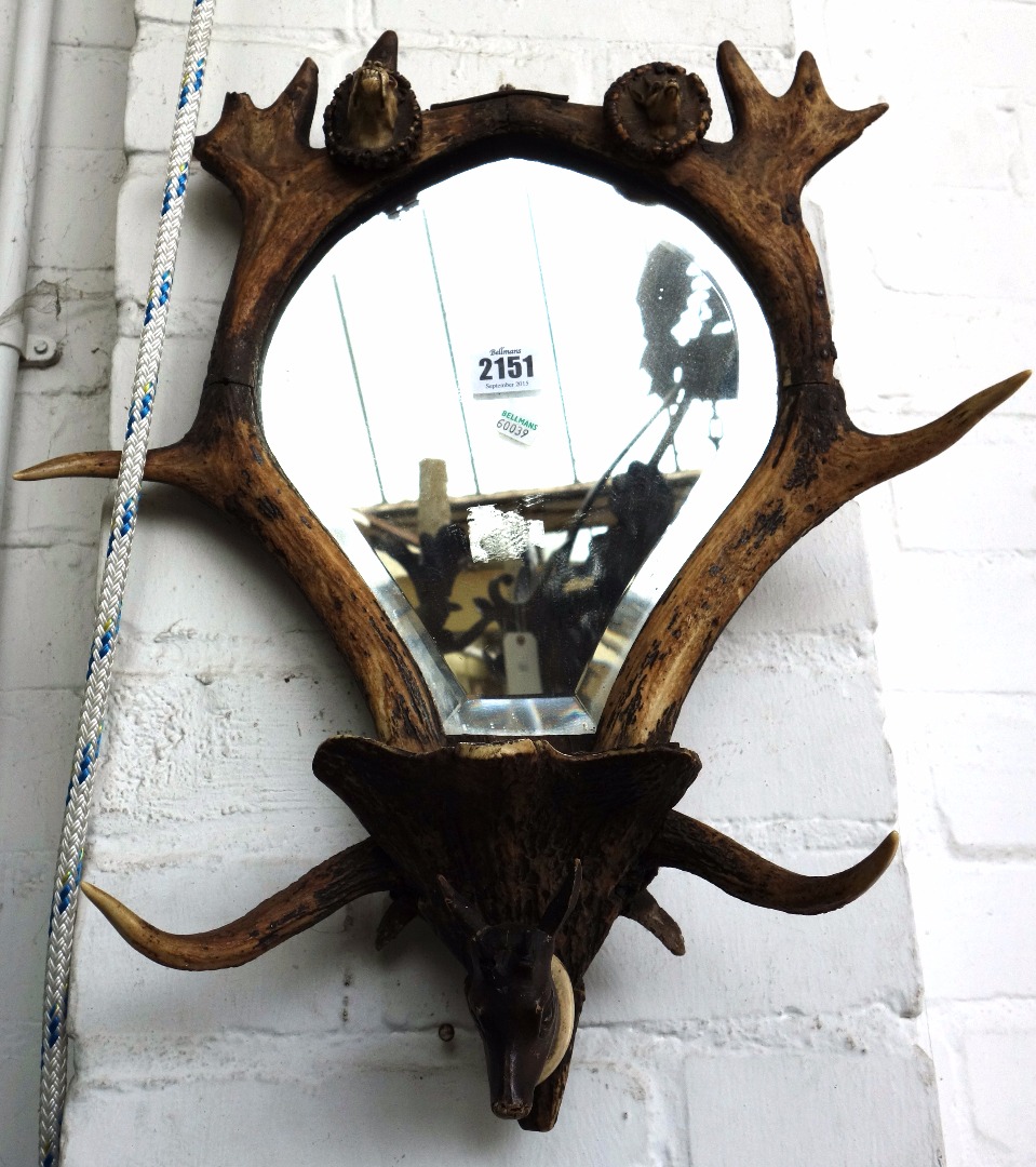 Appraisal: An unusual Black Forest antler wall mirror th century the